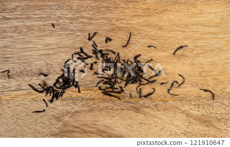 Flavored Black Tea Leaves Scattered Texture, High Quality Black Tea Pile with Fruits and Flowers, Dry Tea Flavored Black Tea Leaves Scattered Texture, High Quality Black Tea Pile with Fruits and Flowers, Dry Tea 121910647