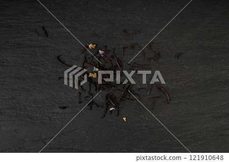 Flavored Black Tea Leaves Pile Texture, High Quality Black Tea Pile with Fruits and Flowers, Dry Tea Leaves Flavored Black Tea Leaves Pile Texture, High Quality Black Tea Pile with Fruits and Flowers, Dry Tea Leaves 121910648