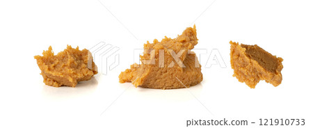 Miso paste isolated. Japanese shiro miso seasoning sauce, fermented soybean spread, brown soy cream Miso paste isolated. Japanese shiro miso seasoning sauce, fermented soybean spread, brown soy cream 121910733