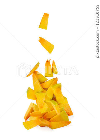 Falling Pumpkin piece isolated, sweet kabocha squash cut, flying sliced acorn pumpkin on white 121910755