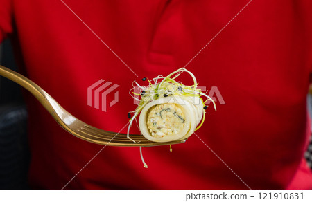 Rolls filled with cream cheese, cold appetizer, Georgian cuisine. White small cheese rolls 121910831