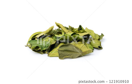 Thai lime dried leaves isolated, makrut lime or Citrus hystrix leaf pile, kaffir lime dry sprouts, Asia spices 121910910