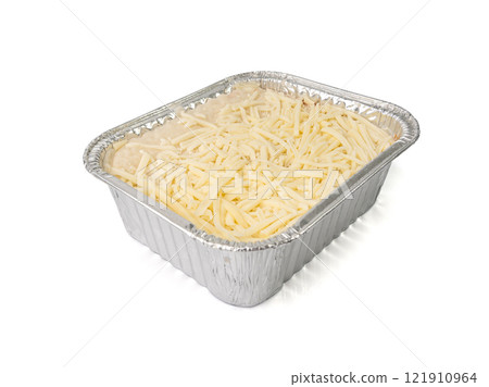 Lasagna portion in aluminium foil tray isolated. Oven baked lasagne for heating, container, airplane food Lasagna portion in aluminium foil tray isolated. Oven baked lasagne for heating, container, airplane food 121910964