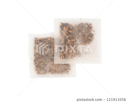 Dry black tea bag with hibiscus, fruits isolated. Raspberry seeds red tea sachet, herbal drink 121911056
