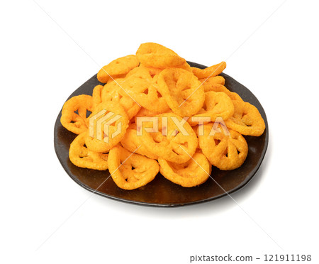 Corn puff snack isolated, crunchy cereal nosh, crispy yellow rice breakfast with paprika Corn puff snack isolated, crunchy cereal nosh, crispy yellow rice breakfast with paprika 121911198