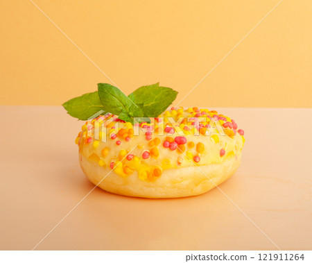 Doughnuts Isolated, Glazed Frosted Donuts with Colorful Sprinkles Doughnuts Isolated, Glazed Frosted Donuts with Colorful Sprinkles 121911264