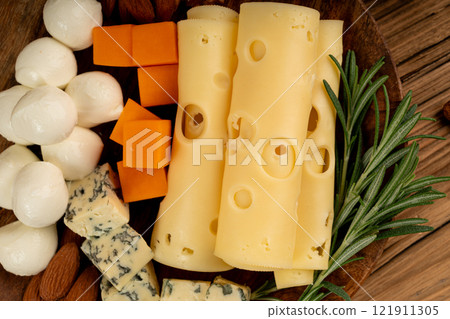 Cheese plate of color cheeses variety, yellow, white and blue cheese board, assorted dairy products 121911305