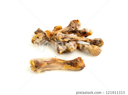 Chicken Leftovers, Unfinished Grilled Chicken on Dirty Plate Isolated, Meat Pieces and Bones after Dinner Chicken Leftovers, Unfinished Grilled Chicken on Dirty Plate Isolated, Meat Pieces and Bones after Dinner 121911313