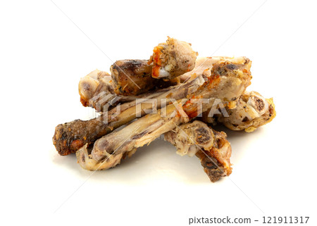 Chicken Leftovers, Unfinished Grilled Chicken on Dirty Plate Isolated, Meat Pieces and Bones after Dinner Chicken Leftovers, Unfinished Grilled Chicken on Dirty Plate Isolated, Meat Pieces and Bones after Dinner 121911317