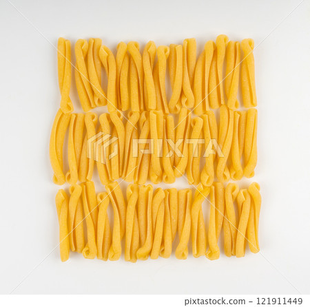 Casarecce pasta isolated, dry traditional macaroni, raw casarecce, wheat noodles, Italy cuisine ingredient 121911449