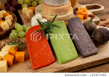 Cheese plate of color cheeses variety, yellow, white and blue cheese board, assorted dairy products Cheese plate of color cheeses variety, yellow, white and blue cheese board, assorted dairy products 121911483