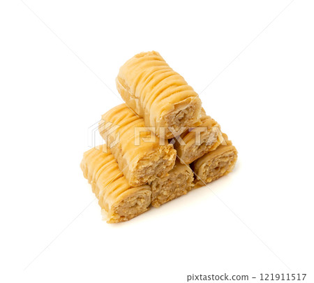 Rolled Baklava Isolated, Ramadan Dessert Roll on Restaurant Plate, Eastern Sweet Pastries Rolled Baklava Isolated, Ramadan Dessert Roll on Restaurant Plate, Eastern Sweet Pastries 121911517