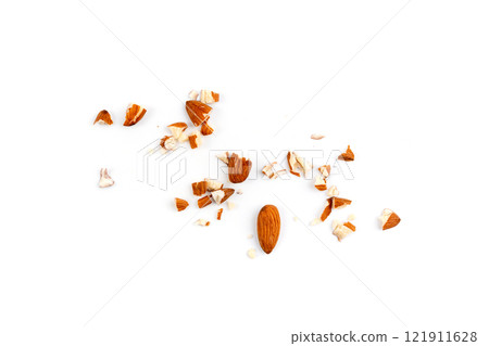 Crushed almonds isolated, nut pieces, sliced scattered almond seeds and cut kernels collection on white background 121911628