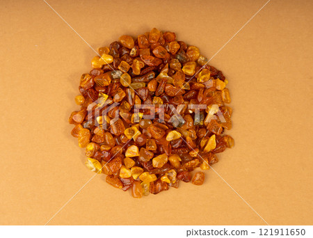 Amber stones, polished orange gemstones, natural Baltic amber gems, golden fossilized tree resin Amber stones, polished orange gemstones, natural Baltic amber gems, golden fossilized tree resin 121911650
