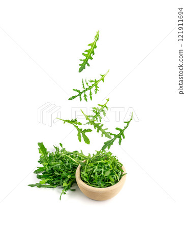 Falling Arugula, Arugula, Ruccola Leaves, Rucola, Eruca or Roquette Salad 121911694
