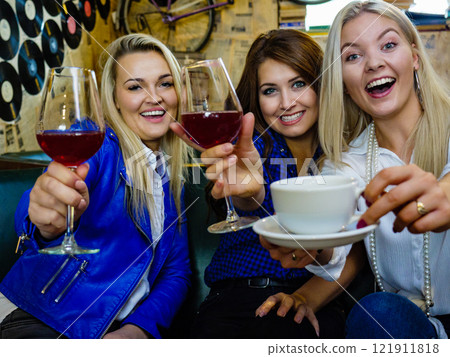 Happy girls in pub club having fun 121911818