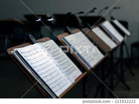 Music stands with musical notes in a rehearsal room Music stands with musical notes in a rehearsal room 121912222