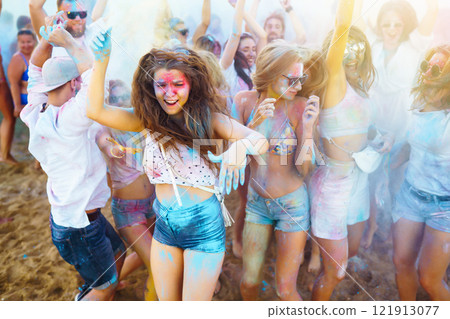 A group of friends have fun, dance at the holi festival. Celebrating traditional indian spring holiday. Friendship. 121913077