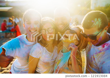 A group of friends have fun, dance at the holi festival. Celebrating traditional indian spring holiday. Friendship. A group of friends have fun, dance at the holi festival. Celebrating traditional indian spring holiday. Friendship. 121913084