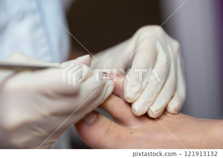 Closeup of professional pedicurist working Closeup of professional pedicurist working 121913132