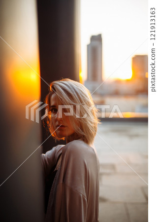 Young woman posing in roof, amazing view of city from roof. . Fashion, style concept. Lifestyle. 121913163