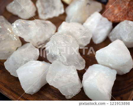 White calcite crystals, handful of pretty stones, close up. Geology and mineralogy concept White calcite crystals, handful of pretty stones, close up. Geology and mineralogy concept 121913898