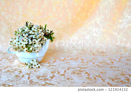 Bodegon with wild flowers in a bowl, giving it a warm touch by putting a velvety background 121914132