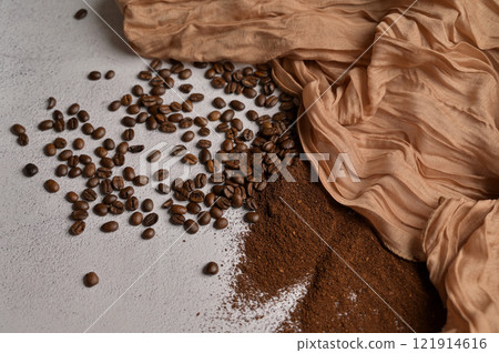 Fresh aromatic grain and ground coffee, white background, brown cloth 121914616