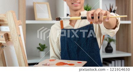 Creative painting session by aspiring artist in home studio artistic expression indoor close up passion for art 121914630