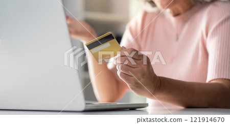 Elderly online shopping experience with credit card home environment digital convenience senior lifestyle 121914670