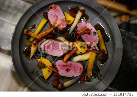 Roasted Japanese pork tenderloin and seasonal vegetables Roasted Japanese pork tenderloin and seasonal vegetables 121914722