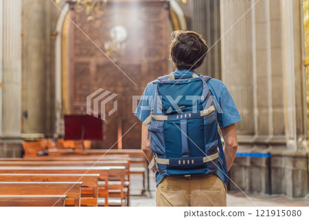 Man tourist exploring the grandeur of Catedral de Puebla, Mexico. Captivating architecture, cultural heritage, and a historic travel experience in one of Mexico's iconic landmarks 121915080