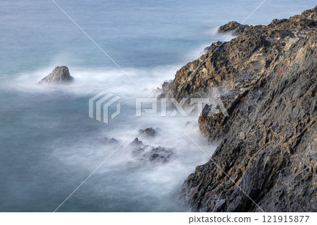 Evening view of the Yakushima Offshore Alps (August) The sea and coast sparkling in the setting sun 121915877