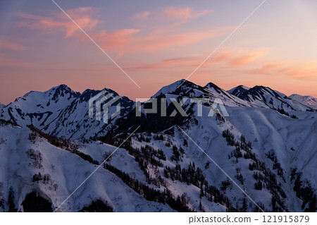 The ridgeline leading to Mt. Harinoki in the afterglow seen from near Hiyaike Pond in the Northern Alps 121915879
