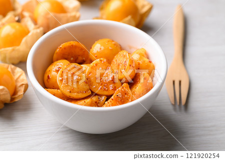 Cape gooseberry or Golden berry (Physalis peruviana) with chili powder and sugar, Spicy fruit salad 121920254