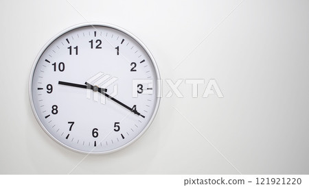 Minimalist White Clock with Silver Frame Striking 21.20/09.20 on White Background. Perfect for Time Management and Corporate Campaigns 121921220