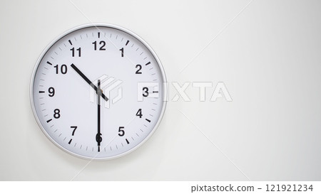 Minimalist White Clock with Silver Frame Striking 22.30/10.30 on White Background. Perfect for Time Management and Corporate Campaigns 121921234