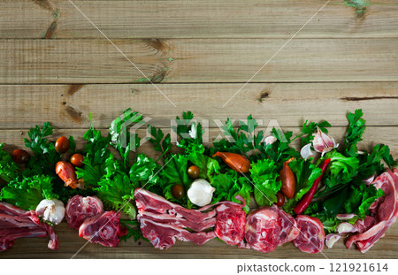Natural border with lamb and greens Natural border with lamb and greens 121921614