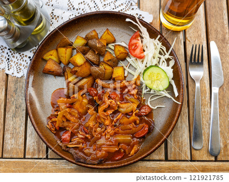 Tulacka - beef roast beef with smoked lard, sausage and cucumber. Slovak cuisine Tulacka - beef roast beef with smoked lard, sausage and cucumber. Slovak cuisine 121921785
