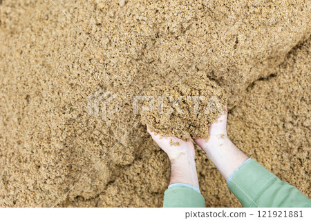 Closeup of beer bagasse in female hands Closeup of beer bagasse in female hands 121921881
