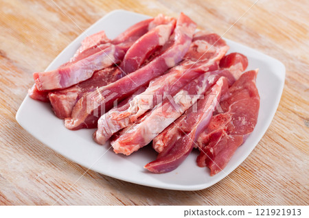 Fresh raw turkey fillet on wooden desk before cooking 121921913