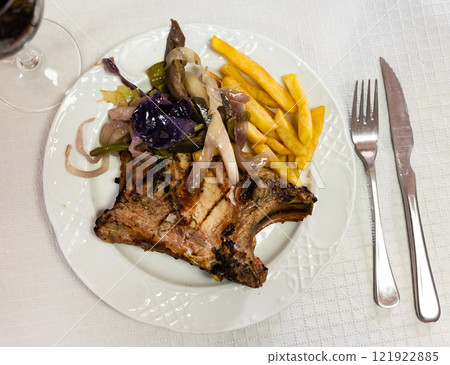 Pork chop with potatoes and vegetables Pork chop with potatoes and vegetables 121922885