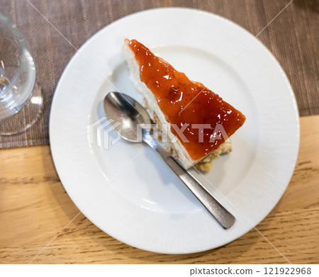 Piece of strawberry cheesecake served for dessert Piece of strawberry cheesecake served for dessert 121922968