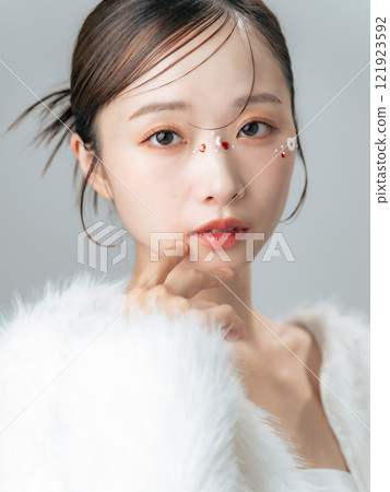 Fashion image of a woman wearing a fur coat Cosmetics, beauty, skin care 121923592
