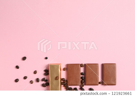 Chocolate bars with coffee beans on a pink background 121923661