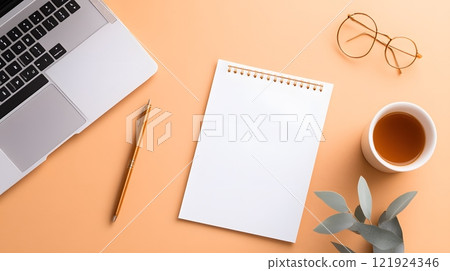 Elegant workspace with a blank calendar, designer pens, and an open laptop, perfect for goal setting 121924346