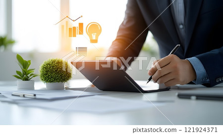 Team brainstorming session with a businessman using a digital tablet as the main presentation tool Team brainstorming session with a businessman using a digital tablet as the main presentation tool 121924371