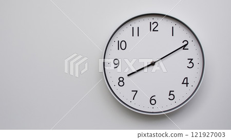 Minimalist Analog Wall Clock with White Face and Simple Black Hands Showing 20.10/08.10 - Ideal for Time Management and Modern Decor Concepts 121927003