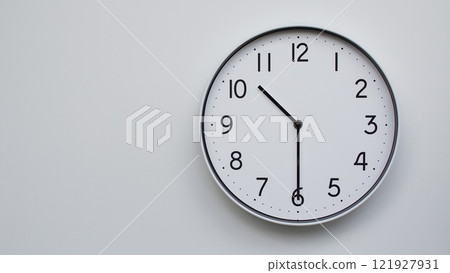 Minimalist Analog Wall Clock with White Face and Simple Black Hands Showing 10.30/22.30 - Ideal for Time Management and Modern Decor Concepts 121927931
