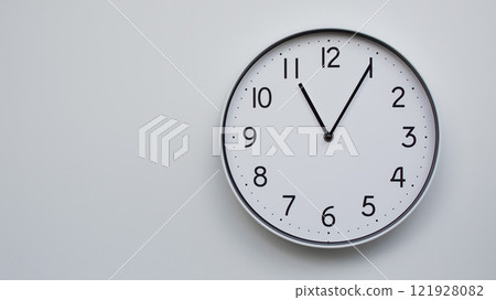 Minimalist Analog Wall Clock with White Face and Simple Black Hands Showing 11.05/23.05 - Ideal for Time Management and Modern Decor Concepts 121928082